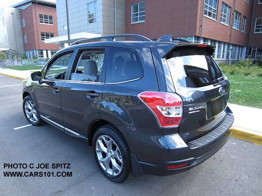 rear view 2016 Forester 2.5 Touring,  optional side moldings, splash guards, bumper coverdark gray color shown