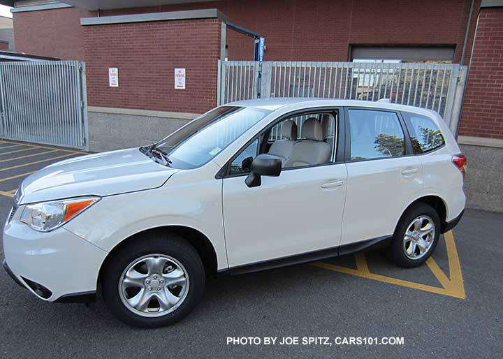 2016 Forester 2.5i base model with steel wheels and no roof rails, white shown.