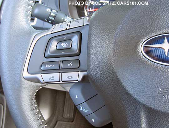 closeup of the 2016 Subaru Forester steering wheel audio, bluetooth and center LCD display control buttons- leather wrapped Limited and Touring models