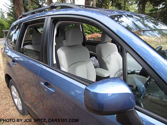 2016 Forester 2.5i and Premium black window trim. Quartz Blue Premium shown with painted outside mirror