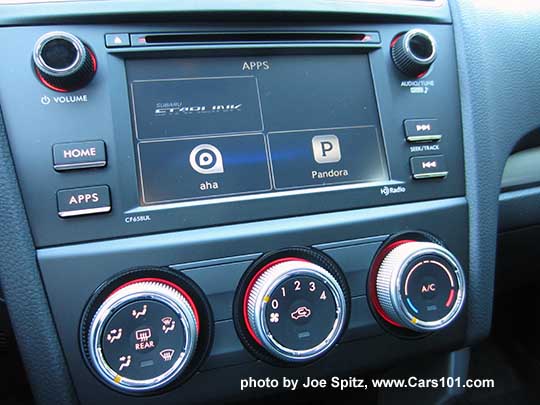 2018 and 2017 Subaru Forester 2.5i base model 6.2" audio screen with physical buttons showing the Apps screen. Manual heater/AC controls with 4 speed fan and red lighting