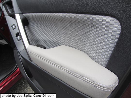 2018 and 2017 Forester front passenger inner door panel with platinum gray cloth door insert and armrest.