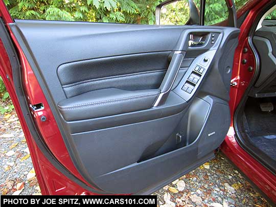 2018 and 2017 Subaru Forester driver inner door panel with black perforated leatherette door insert.