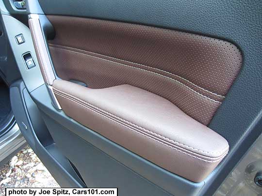 closeup of the 2017 Subaru Forester inner front passenger door panel with perforated saddle brown leatherette insert