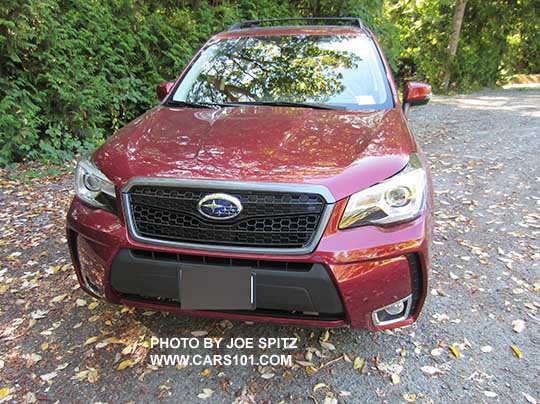 2018 and 2017 Forester XT model optional Sport Grill with honeycomb center strip and Subaru logo.  2.0XT Touring model shown with fog lights. Venetian red.