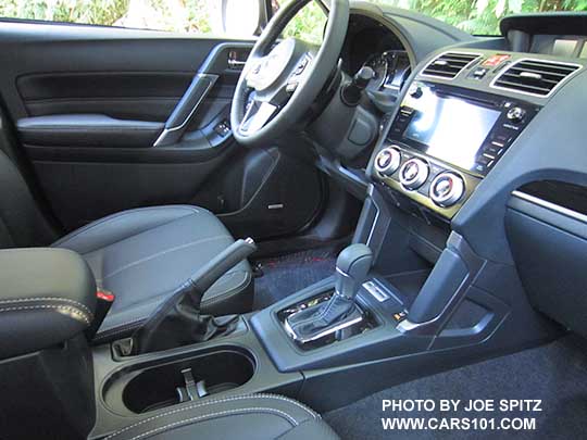 2018 and 2017 Subaru Forester 2.5i and XT Touring black leather interior, silver stitching, gloss black trim. XT shown with paddle shifter