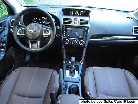 2018 and 2017 Subaru Forester 2.0XT Touring dash and console, showing XT's turbo boost gauge on the upper console trip computer. Saddle brown leather shown