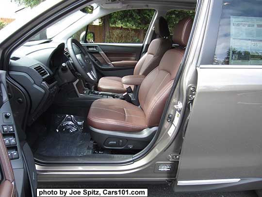 2018 and 2017 Subaru Forester 2.5i and 2.0XT Touring saddle brown leather front seats in the shade with center armrest in the forward position. The leather looks different depending on the light. Sepia bronze car shown