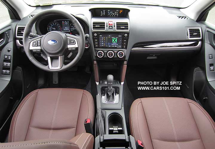 2018 and 2017 Subaru Forester saddle brown perforated leather trimmed front seats. Gray leather steering wheel. Gloss black dash trim and shift surround, leather center console trim