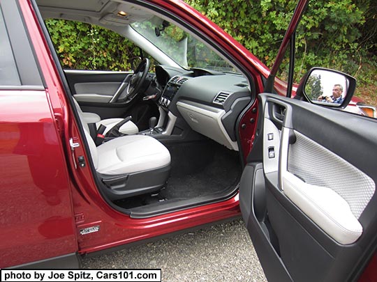 2018 and 2017 Subaru Forester Premium platinum gray cloth interior, silver dash trim. Venetian red car