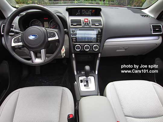 2017 Subaru Forester Premium platinum gray cloth front driver and passenger seat. Silver dash and shift trim.