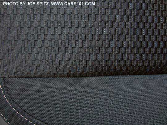 closeup of the 2017 Subaru Forester black cloth interior, silver stitching