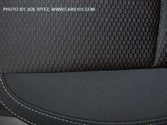 closeup of the 2018 and 2017 Subaru
                Forester 2.5i and 2.5i Premium black cloth interior,
                silver stitching