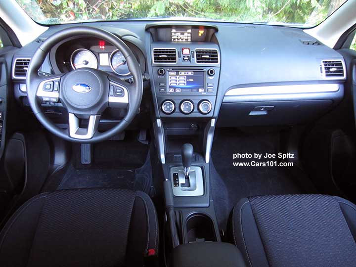2018 and 2017 Subaru Forester 2.5i base model black cloth interior. Notice the 6.2" audio system with physical buttons.