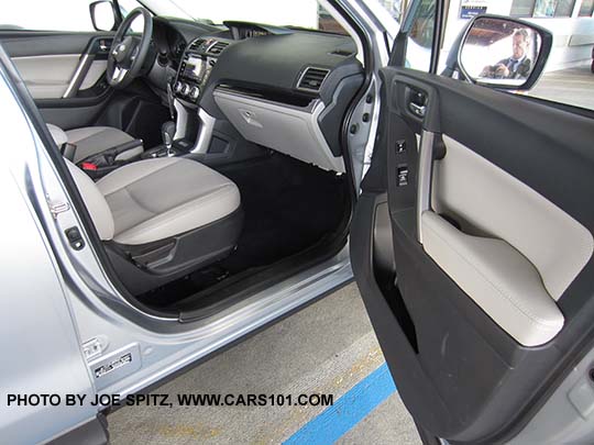 2018 and 2017 Subaru Forester Limited front passenger door and seats, glass black dash trim. Platinum light gray leather shown