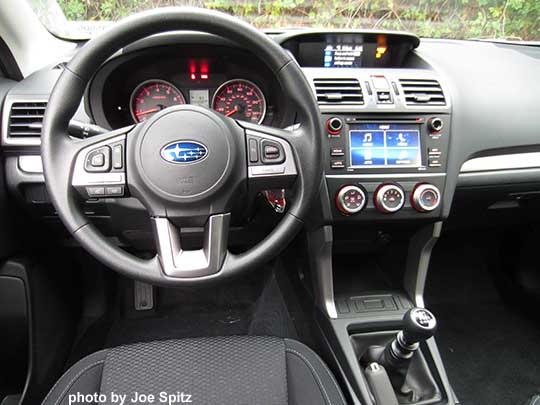 2018 and 2017 Subaru Forester 2.5 base model manual transmission, black cloth, silver dash trim, 6.2" audio with matte gray surround