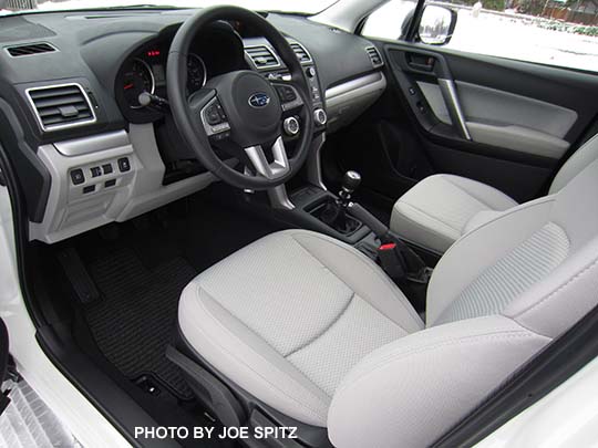 2018 and 2017 Subaru Forester 2.5i manual transmission front dash with silver trim, platinum gray cloth shown