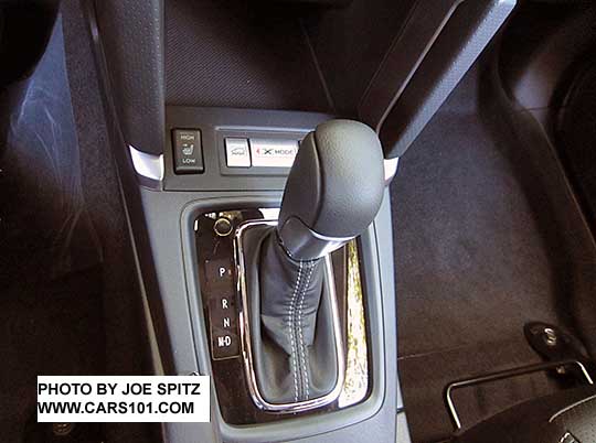 2018 and 2017 Subaru Forester 2.5 and XT Touring gloss black shift plate surround. XT shown with D drive and M manual modes. Dimpled gray leather center console trim