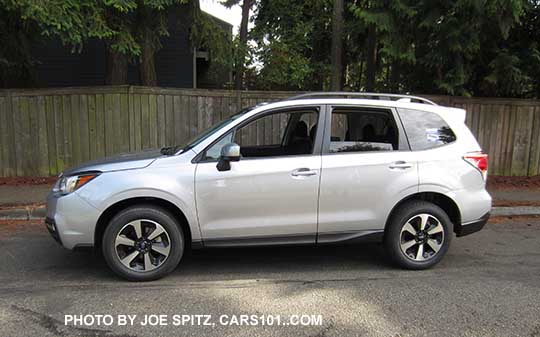 2018 and 2017 Forester Premium with body colored mirrors, dark tinted rear glass, and rear spoiler. Ice silver. New for 2017 wheels and rear spoiler