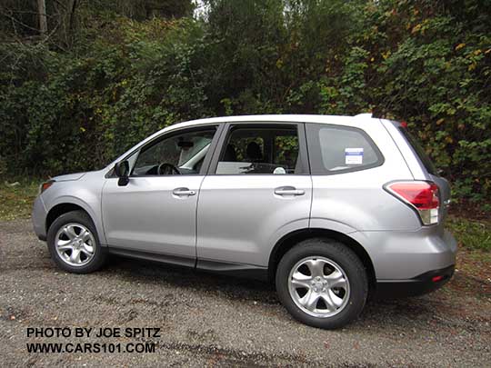 2017 silver Subaru Forester 2.5i base model, has steel wheels, no dark tinted windows, no roof rails