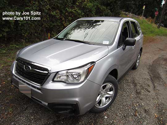 ice silver color 2017 Subaru Forester 2.5i base model, has steel wheels, no roof rails, black unpainted outside mirrors