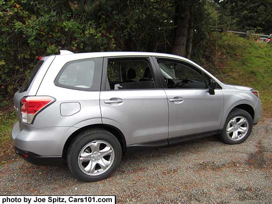 2018 and 2017 Subaru Forester 2.5i base model, ice silver color, has steel wheels, no dark tinted windows, no roof rails