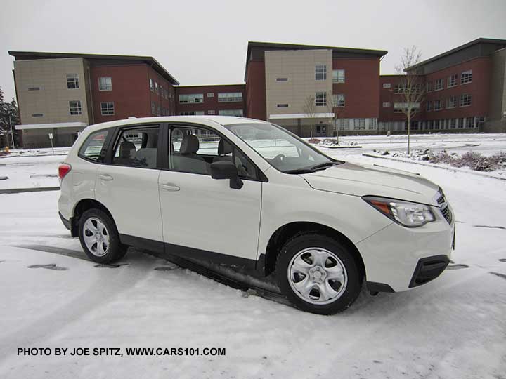 2017 Subaru Forester 2.5i base model, steel wheel, black outside mirrors, no roof rails. Color white shown with optional splash guards