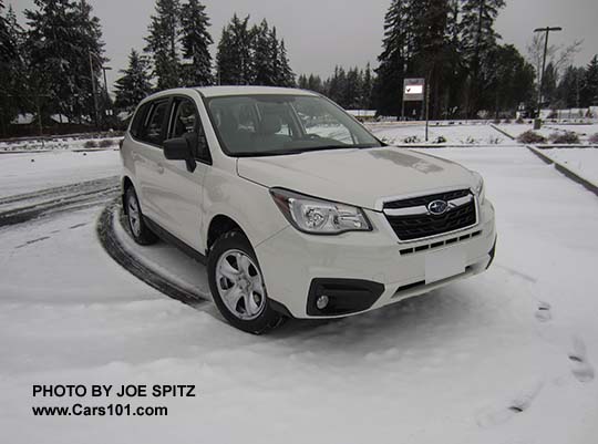 2018 and 2017 Subaru Forester 2.5i, steel wheels, no roof rails.  Optional fog lights.  Color white shown.