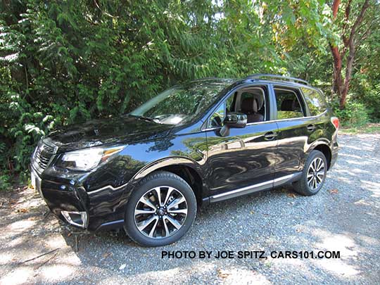 2018 and 2017 Subaru Forester 2.0XT Touring turbo with chrome rocker panel strip. With redesigned for 2017 2.0XT blacked-out front grill and 18" black and silver 5 split-spoke alloys. Crystal black shown.