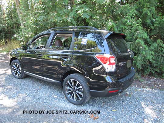 2017 Subaru Forester 2.0XT Touring turbo with chrome rocker panel strip and rear spoiler. With redesigned for 2017 2.0XT blacked-out front grill and 18" black and silver 5 split-spoke alloys. Crystal black shown, with optional rear bumper protector