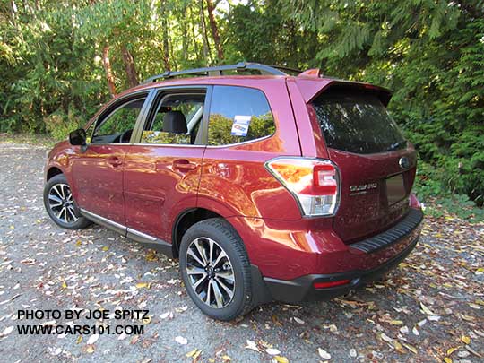 2018 and 2017 Subaru Forester 2.0XT Touring with chrome rocker panel trim, dark rear glass, body colored rear spoiler.  Redesigned XT model 18" split-spoke black and silver alloys,  Venetian Red shown.