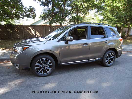 2018 and 2017 Forester 2.0XT Touring with chrome rocker panel trim. Sepia Bronze Metallic color shown. XT model 18" black and silver alloy wheels,