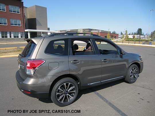 2018 and 2017 Forester 2.0XT Touring with chrome rocker panel trim, rear spoiler. Sepia Bronze Metallic color shown. XT model 18" black and silver alloy wheels.