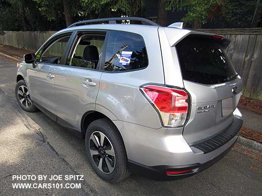 2018 and 2017 Forester Premium with body colored mirrors, dark tinted rear glass, and rear spoiler. Ice silver. New for 2017 wheels and rear spoiler. Optional rear bumper cover.