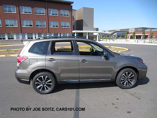 2017 Forester 2.0XT Touring with chrome rocker panel trim, rear spoiler. Sepia Bronze Metallic color shown. XT model 18" black and silver 5 split-spoke alloy wheels,