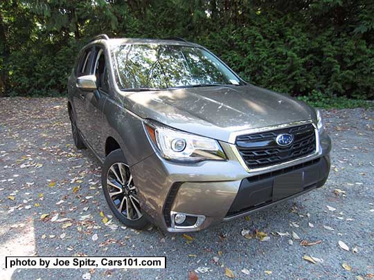 2018 and 2017 Forester 2.0XT Touring with chrome fog light trim. Sepia Bronze Metallic color shown. XT model grill has a with gloss black center strip and center logo and redesigned for 2017 18" black and silver 5 split-spoke alloy wheels