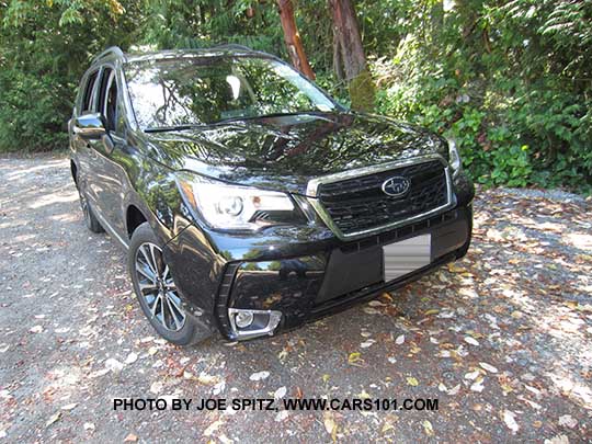 2017 Subaru Forester 2.0XT Touring. Redesigned 2.0XT  18" alloys and the grill has a gloss black center strip and center logo. Crystal black shown.