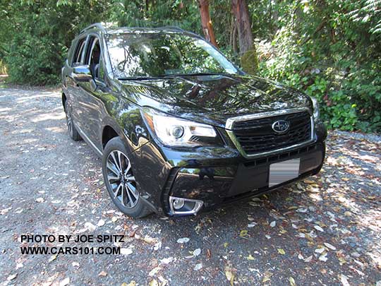 2018 and 2017 Subaru Forester 2.0XT Touring. Redesigned 2.0XT  18" alloys and the front grill has a gloss black center strip and center logo. Crystal black shown.