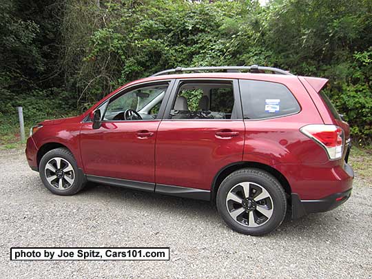 2018 and 2017 Subaru Forester 2.5 Premium with dark tinted rear glass,  redesigned 17" black/silver alloys and new for 2017 Premium model rear spoiler. Venetian Red color shown.