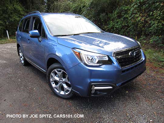 2018 and 2017 Subaru Forester 2.5i Touring, 18" brushed silver wheels, quartz blue color shown