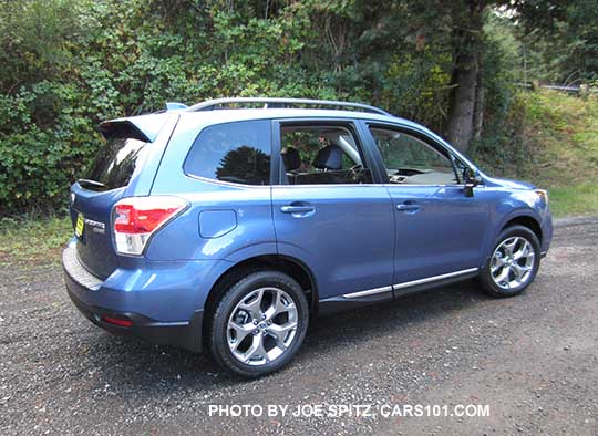 2018 and 2017 Subaru Forester 2.5i Touring, 18" brushed silver wheels, chrome rocker panel trim, quartz blue color shown