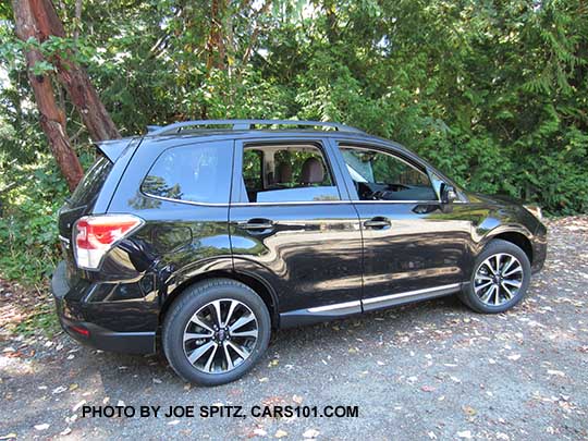 2018 and 2017 Subaru Forester 2.0XT Touring turbo with chrome rocker strip. Redesigned 2.0XT 18" black and silver 5 split spoke alloys. Crystal black shown.