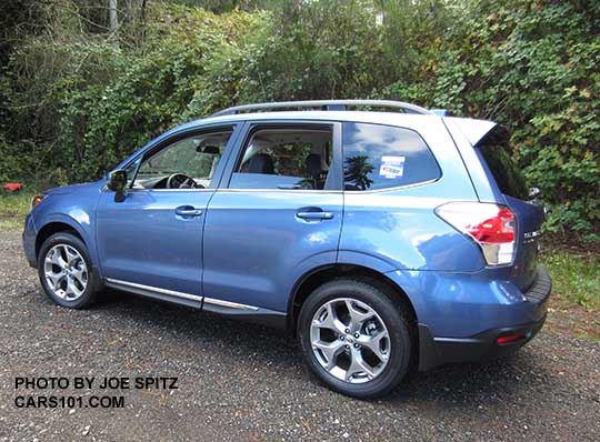 2018 and 2017 Subaru Forester 2.5i Touring, 18" brushed silver wheels, chrome rocker panel trim. quartz blue color shown. Optional splash guards