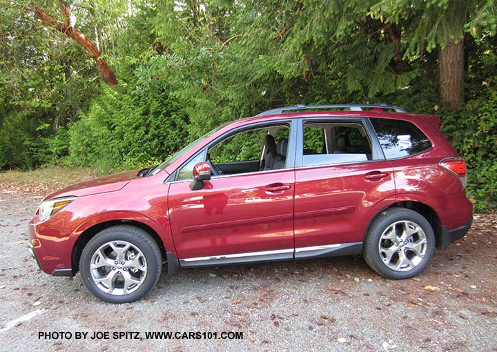 2018 and 2017 Subaru Forester 2.5i Touring has 18" brushed silver wheels, chrome rocker panel trim. Venetian red color shown.