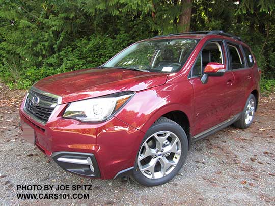 2017 Subaru Forester 2.5i Touring has 18" brushed silver wheels, chrome rocker panel trim. Venetian red color shown.