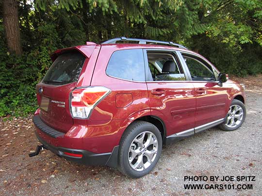 2018 and 2017 Subaru Forester 2.5i Touring has 18" brushed silver wheels, chrome rocker panel trim. Venetian red color shown. Optional body colored bodyside moldings.
