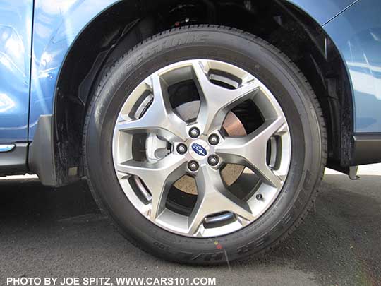 2018 and 2017 Subaru Forester optional splash guard. Right front shown on a blue 2.5i Touring model