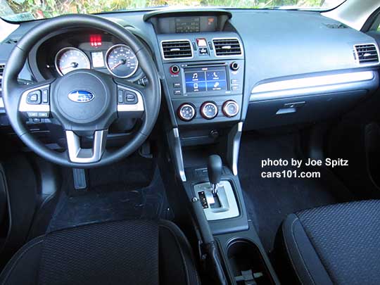 2017 Subaru Forester 2.5i vinyl coated steering wheel with audio, bluetooth and cruise cointrol. The 6.2" audio with physical buttons in the background indicates this is a 2.5i base model.