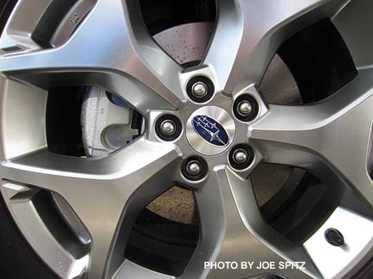 closeup of the 2017 Subaru Forester 2.5i Touring  18" brushed silver alloy wheel