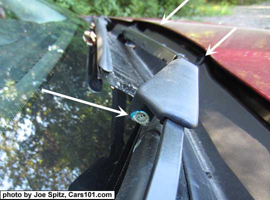 2018 and 2017 Forester with Eyesight has 3 windshield washer fluid sprayers, including one attached to the right wiper arm. See white arrows